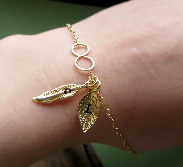 Infinity Bracelet with Personalized Leaf, Feather Charms