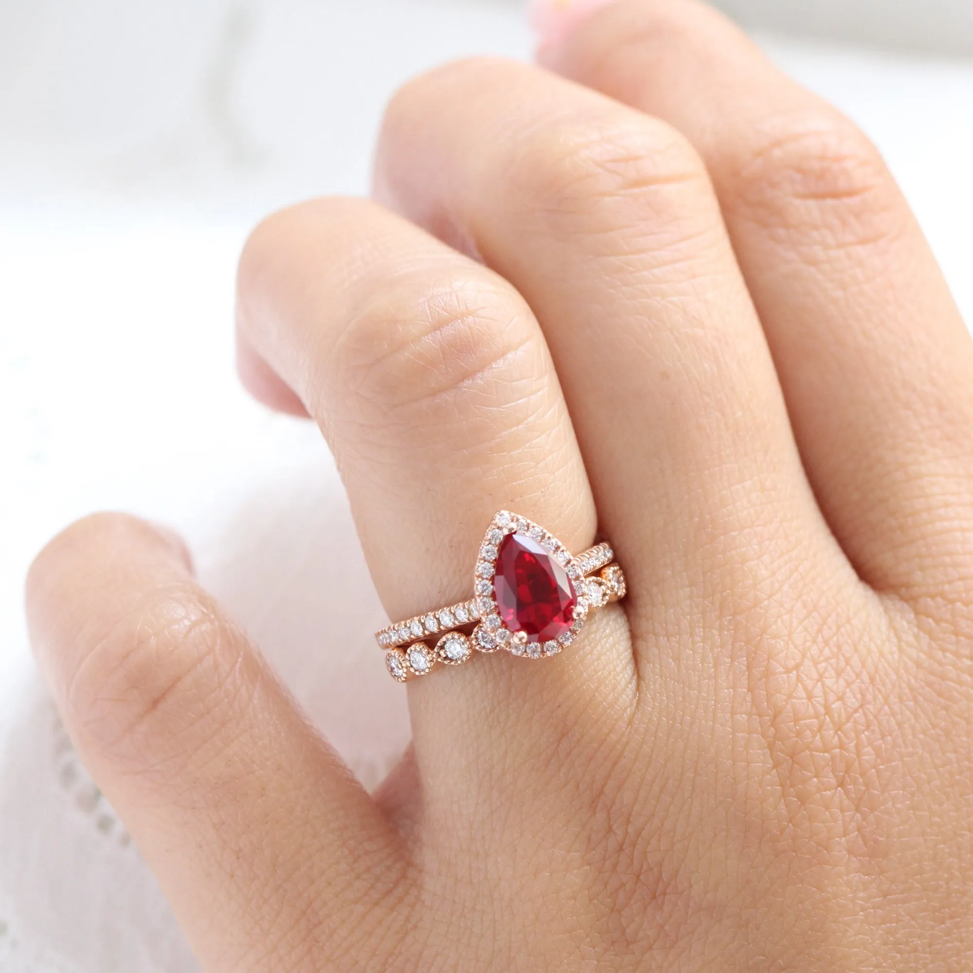 Pear Ruby Engagement Ring in Luna Halo Diamond Pave Band