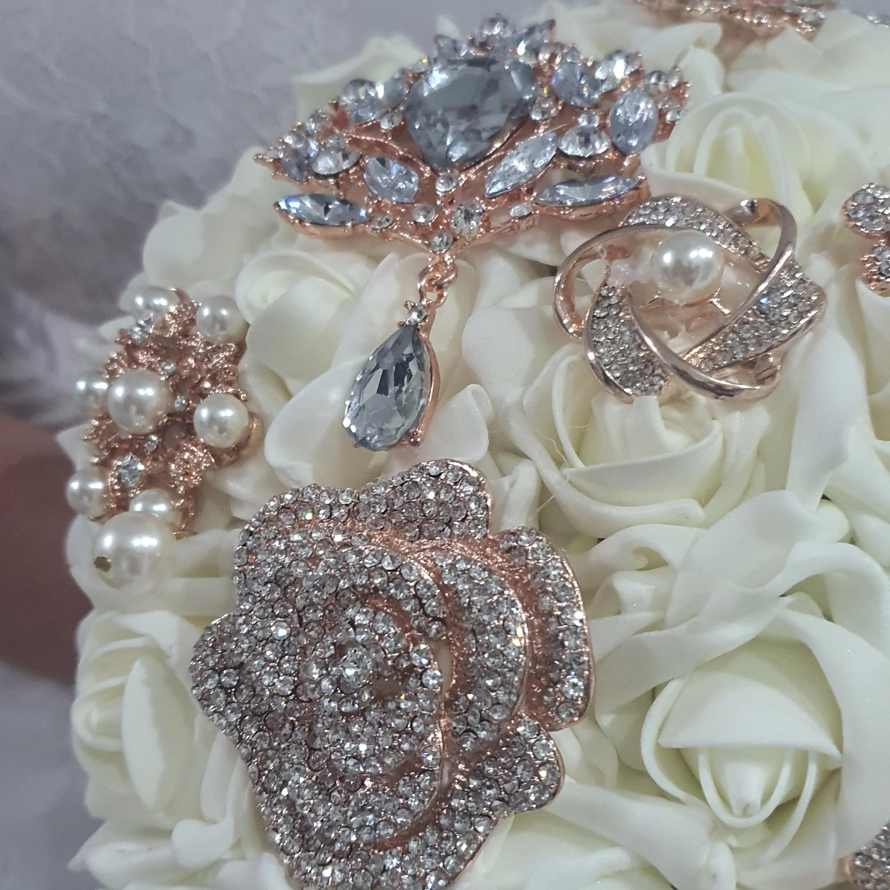 Rose gold Brooch and Pearl drape bouquet by Crystal wedding uk